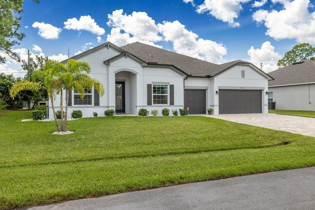 Photo of 1826 SW Starman Ave, Port Saint Lucie, FL 34953 (MLS # F10302263)