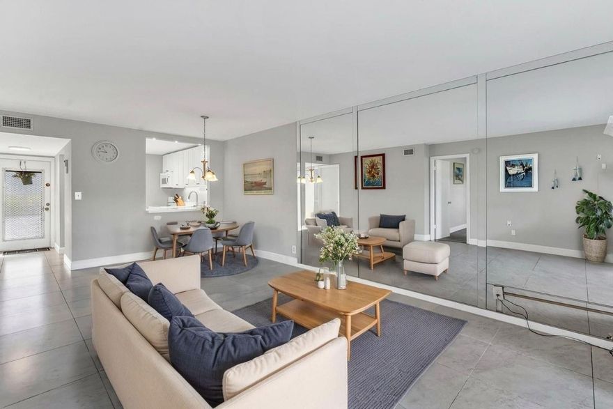 Welcome home to this well maintained first-floor 2/2 in Oriole Gardens—just a 7-min walk to the new Publix Plaza! Offering 990 sq ft with Eastern exposure, this light-filled unit features peaceful canal and garden views for serene living. The renovated kitchen shines with white shaker cabinets, quartz countertops, and modern finishes. The guest bathroom has been updated with a newer shower, and both bathrooms feature newer sinks. Newer carpet in the bedrooms adds comfort, while tiled living areas offer easy maintenance. The primary suite includes a walk-in closet and ensuite bath, while the second bedroom offers dual closets—perfect for guests or home office. Enjoy relaxing on your private patio overlooking the water. Newer carpet in primary bedroom and space for a sitting area.