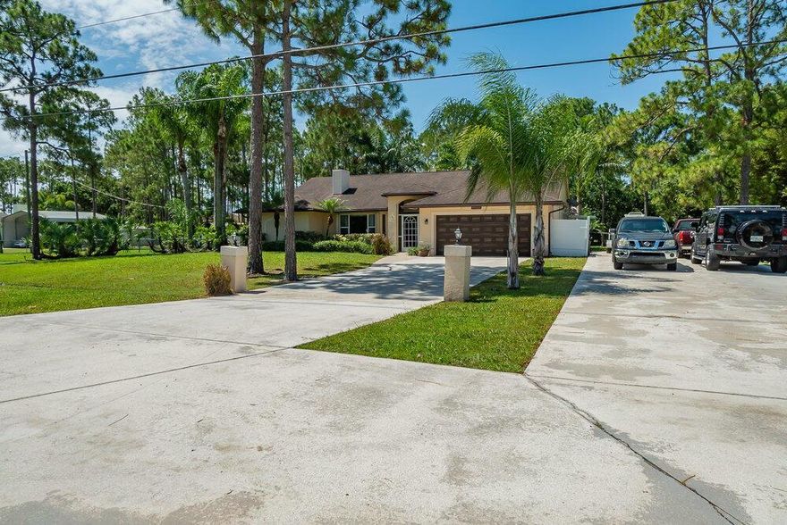 Welcome Home! Move in and start entertaining in this Magnificent 4-bedroom 2- bath pool home.  Home situated on over acre lot with fenced back yard, pave road. Plenty of parking. Home also features recent kitchen/ bath remodels, new flooring, crown molding  throughout a beautiful, covered screen patio, sprinkler system and alarm system. This home , conveniently close to great school, parks & shopping is waiting for you!