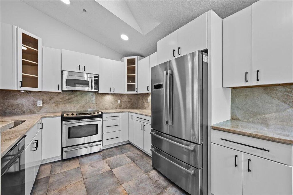 Photo of 11 Dorchester Circle, Palm Beach Gardens, FL 33418 (MLS # R11156374)