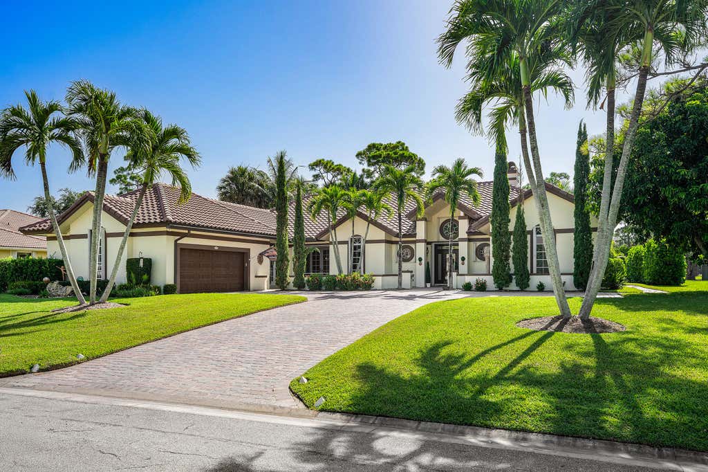 Photo of 586 N Country Club Drive, Atlantis, FL 33462 (MLS # B26065855)