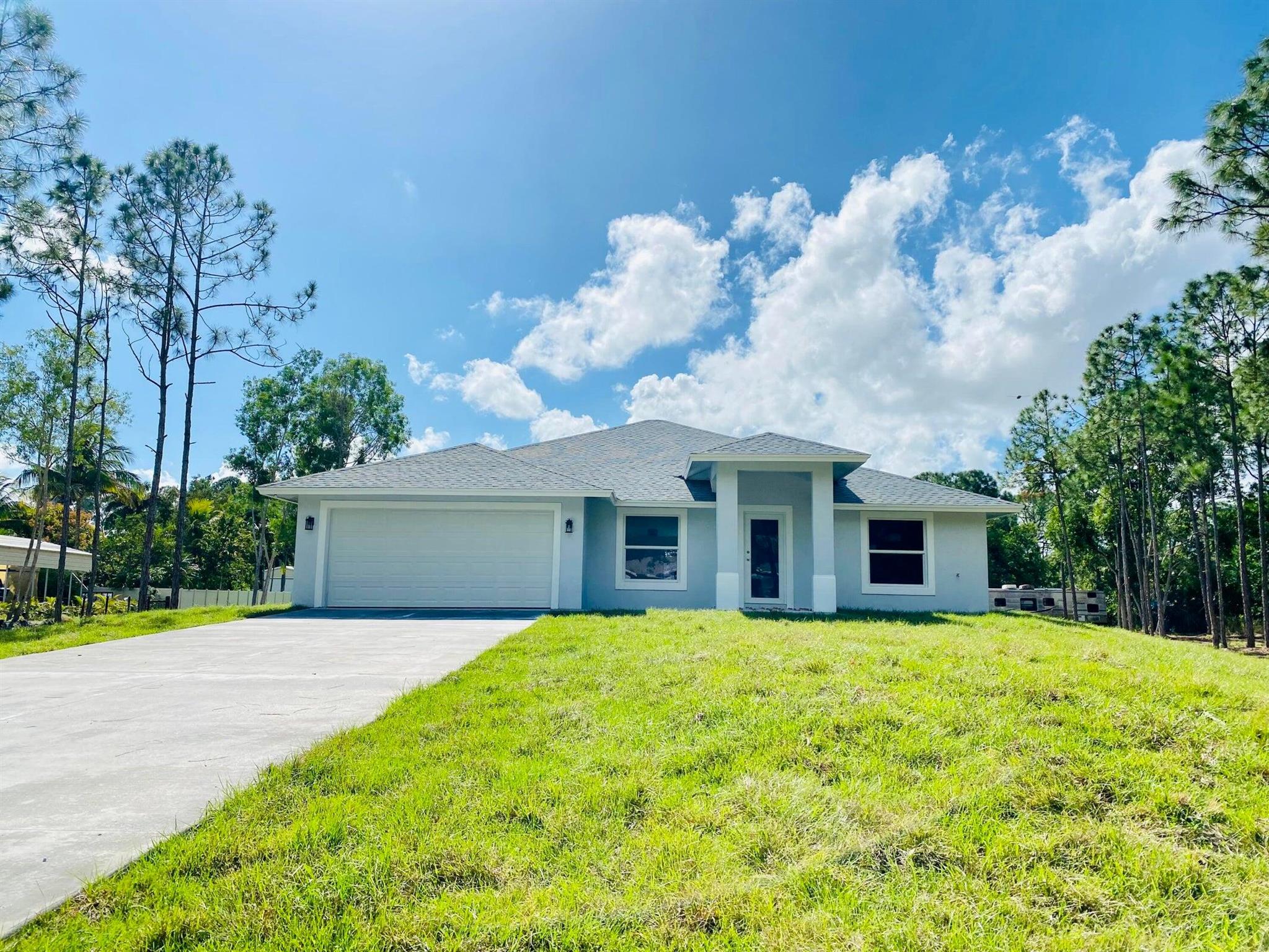 Newer construction on a 1.15-acre lot. 4 bedrooms and 3 full baths with a 2-car garage. Open concept, bright and modern lighting, quartz countertops, stainless steel appliances with porcelain tile flooring throughout. Impact windows and doors, huge ceilings, separate laundry room, large primary walk-in closets and many more upgrades. More pictures coming.