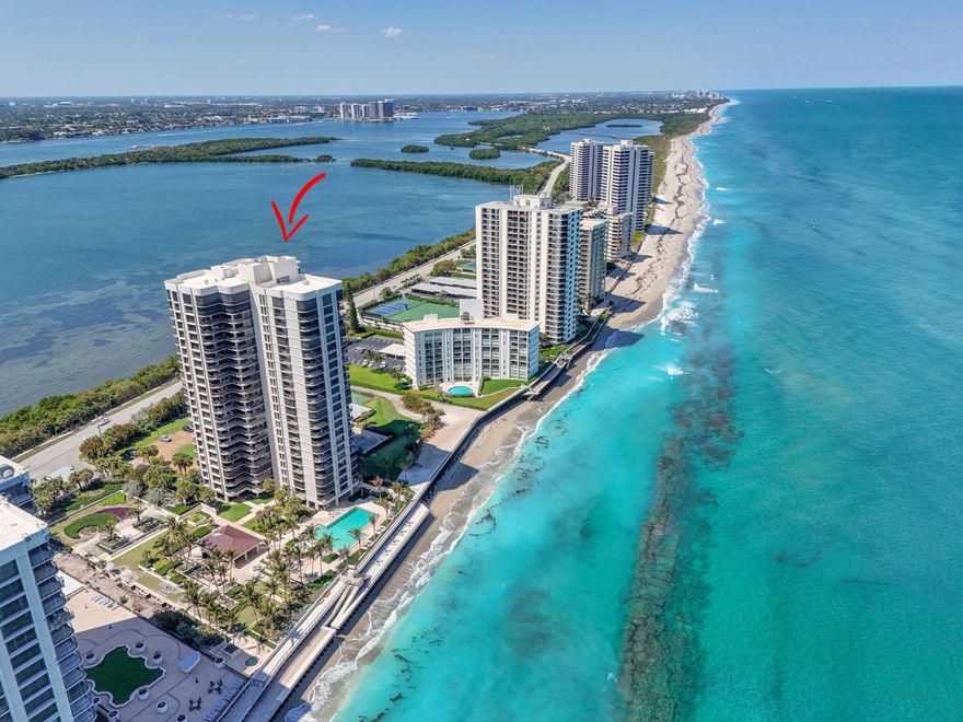 Panoramic ocean and intracoastal views surround this 24th-floor corner residence, offering eastern, northern & western exposures and fabulous sunrise-to-sunset views. Ideally positioned just below the penthouse, this premium tower location provides both privacy and sweeping water and island scenery. Located on the quiet north end of Singer Island, with convenient access to PGA Blvd for world-class shopping, dining, and entertainment, this spacious condominium features a sprawling floor plan with 3 bedrooms and 3.5 bathrooms. The residence was thoughtfully updated in 2023 with a brand-new kitchen redesigned to create an open-concept living space ideal for entertaining. Highlights include custom white cabinetry, quartz countertops, two refrigerators & oversized island. >> Floor-to-ceiling hurricane impact glass windows highlight the stunning water views from every window. Additional features include a double-door front entry, a full laundry room in the unit, and a large private storage closet conveniently located in the hallway just outside the front door. Italian marble flooring flows throughout the main living areas and primary suite, while the guest bedrooms feature beautiful wood flooring in a coastal color palette. An expansive 740 sqft of wraparound balconies for outdoor living, protected by accordion storm shutters. Brand new A/C has just been installed. Water heater is 2022. Featuring only 3 units per floor, this luxury oceanfront tower has undergone extensive renovations both inside and out, including a new seawall and a raised lower sun deck with beach sand and lounge chairs overlooking the ocean. Residents also enjoy a fabulous tropically landscaped pool area with open and shaded seating, spa, 24/7 manned security gate, updated lobby with front desk attendant, fitness center, community room with library, game room and on-site property manager. All special assessments have been paid by the seller. Offered fully furnished turnkey or unfurnished, the choice is yours. Watch dolphins, manatees, sea turtles and more from your balcony. Welcome home!