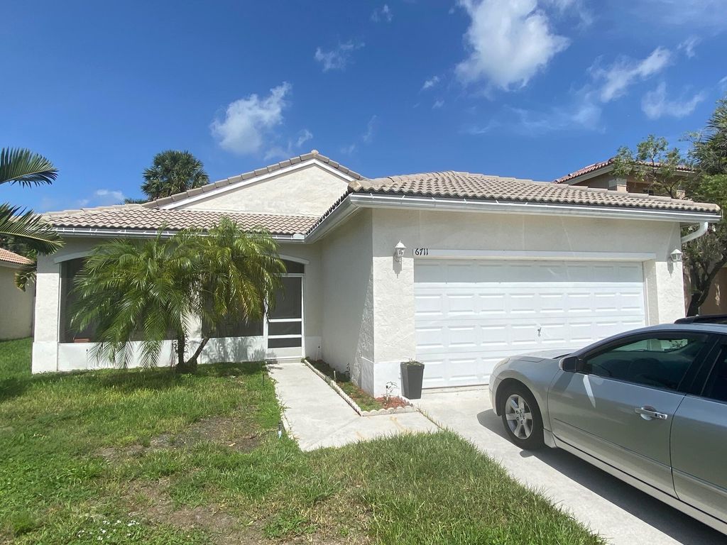 Photo of 6711 Stonecreek Street, Greenacres, FL 33413 (MLS # B26034213)