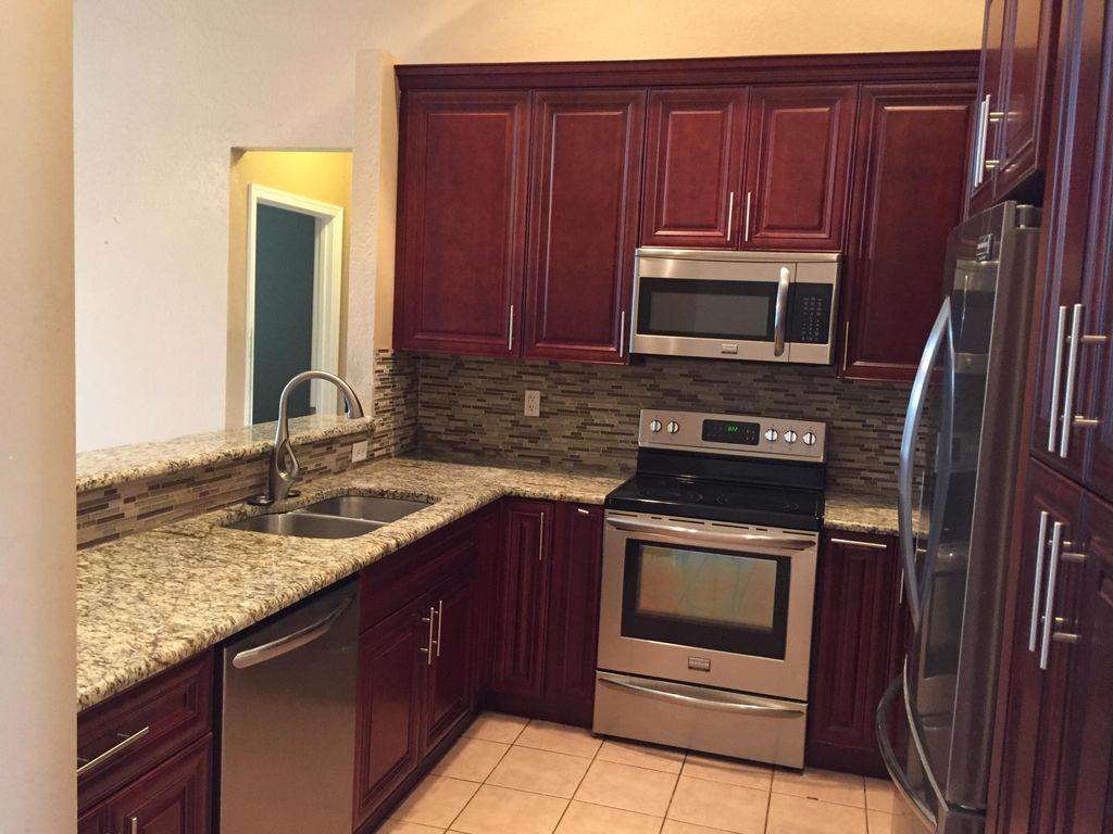 Photo of 6711 Stonecreek Street, Greenacres, FL 33413 (MLS # B26034213)