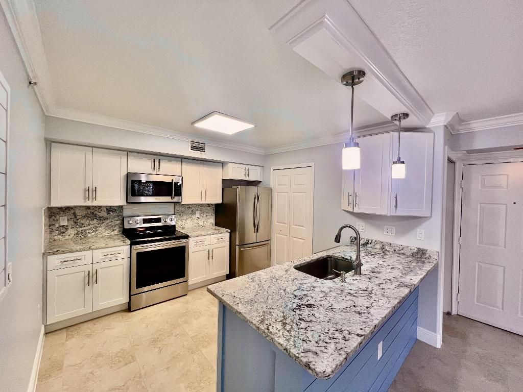 Photo of 131 SW Palm Drive #103, Port Saint Lucie, FL 34986 (MLS # R11017818)