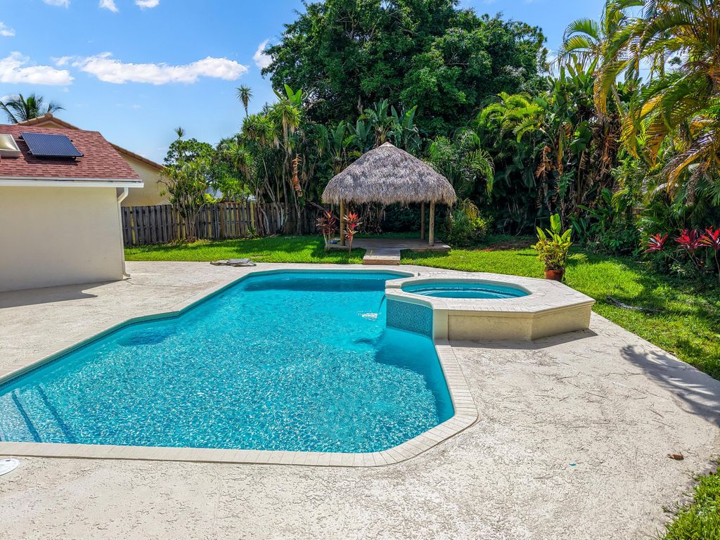 Photo of 4100 NW 7th Lane, Delray Beach, FL 33445 (MLS # R11114859)