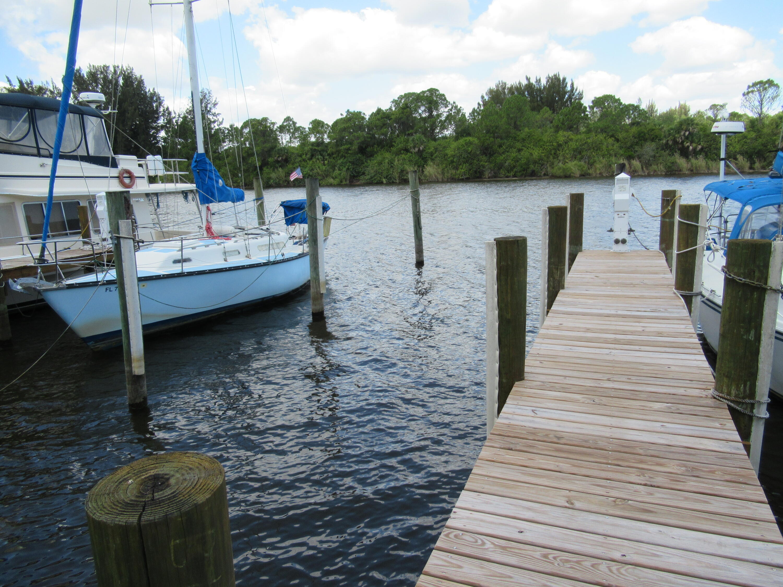 Bring you boat to your private, protected, fresh water boat slip located directly on the St. Lucie River, just West of I-95 and the St. Lucie Locks. Access to the Atlantic Ocean, Lake Okeechobee and the Gulf Coast. Approximately 1 hour to St. Lucie Inlet. Includes piling bumpers and one grassed parking space. Approximate maximum 50' vessel length, 14' beam, 6' draft. Low $43.33 monthly fees include Electric, Martin County Water and Taxes. Balance of 99 year leasehold ownership through June, 2104. Slip leasehold can be sold outright or transferred. No dock rentals or live aboards permitted. See documents section for more information. Get protection for your boat before the storms! Other slips available.
