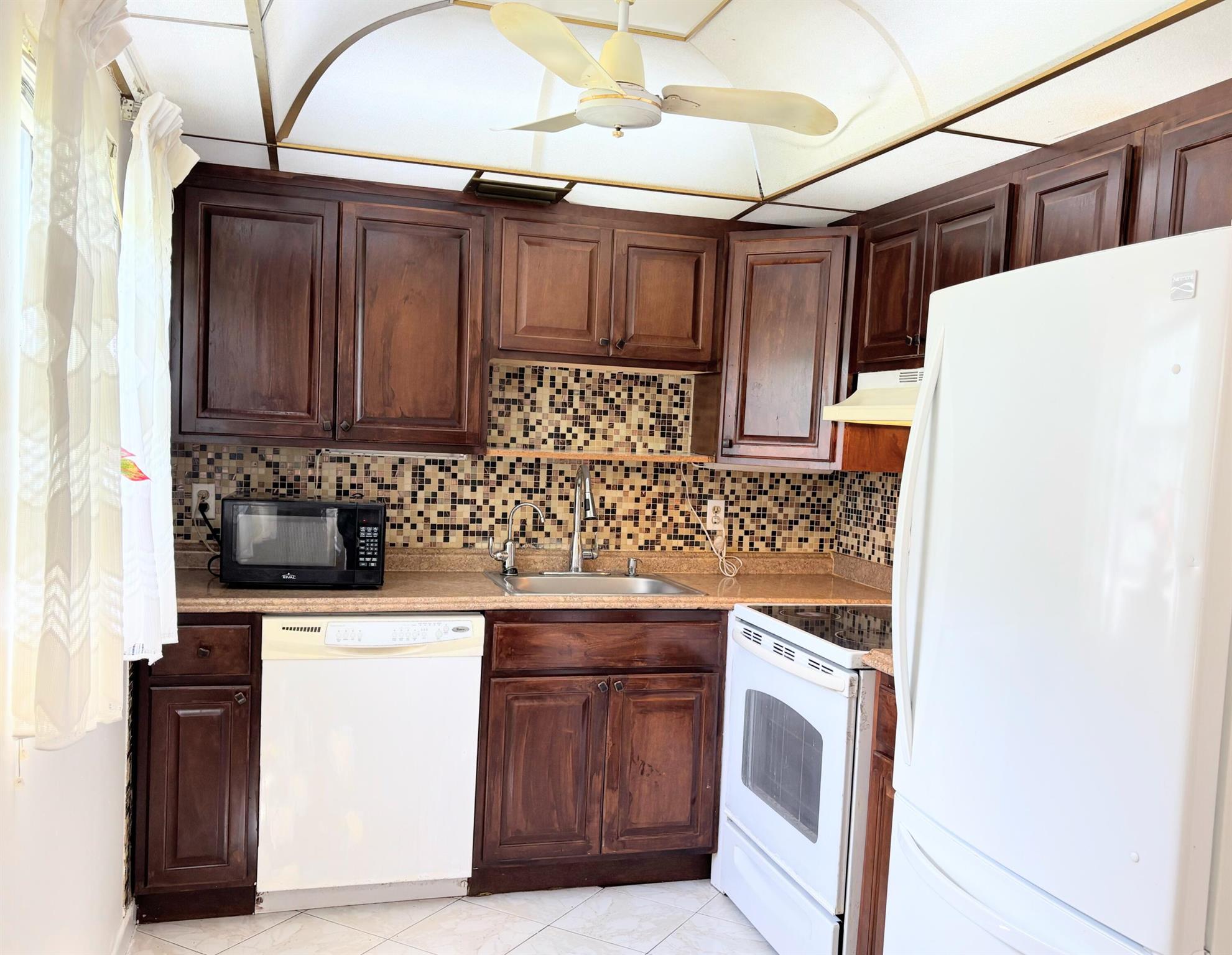 <Lowest HOA Condo, newly Painted 2 Bedroom and 2 Bath on the first Floor, garden view, enclosed patio with ac very quiet, tiled throughout , NEW AC, New LED Lighting i in Resort Style 55 plus Community 6 pools indoor and outdoor, pools Close to Club House with beautiful pool and Jacuzzi a gym State of the Art theater, with live shows, Golf Course, Tennis, Pickle Ball, Card room, Beauty Salon, courtesy Buses, Cafeteria, and a Bistro in Monaco Club House. Art classes and more, courtesy buses take you shopping. Close to Downtown Delray Beach and restaurants. great location.