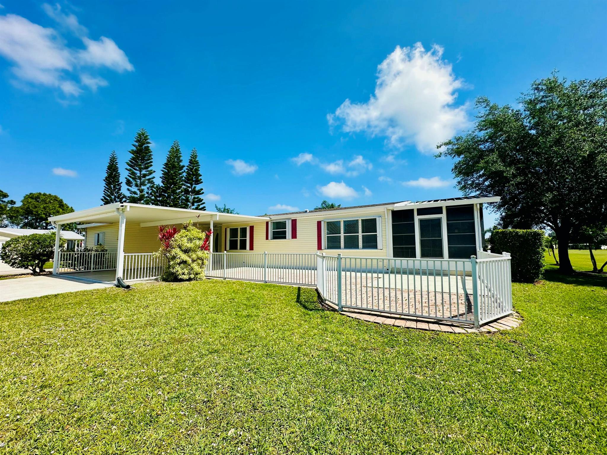 Expanded Coral Reef model on oversized corner lot with golf views in the Savanna Club 55+ community. Home offers over 1,720 feet of living in a desirable spilt plan with 2 spacious bedrooms, 2 baths and a bonus den/office for third bedroom and updated floors, paint and appliances. The enclosed lanai can be additional living space and entertaining on your open pavered patio is ideal for block parties and gatherings with plenty of parking available as well. The shed is 15 X 15 and could easily accommodate a golf cart. See this one today for size, value and location.