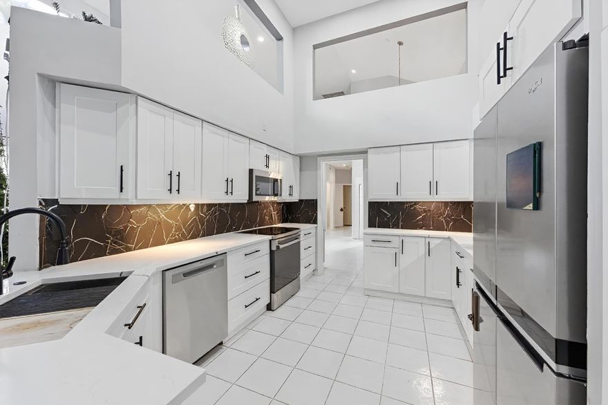 Experience luxury living in this stunning two-story home in the gated Banyans at Broken Sound Country Club, an exclusive membership community in Boca Raton. This residence offers 4 bedrooms and 3.5 bathrooms, soaring ceilings, and an open-concept layout. The gourmet kitchen features quartz countertops, custom cabinetry, and stainless steel appliances. The first-floor primary suite includes a walk-in closet and a luxurious bath, plus a flexible office/guest suite. Upstairs are two bedrooms sharing a beautifully designed bathroom. Enjoy a screened patio, private tropical-style pool, and a two-car garage with access to world-class community amenities. The seller is currently installing Impact windows and sliding glass doors.
