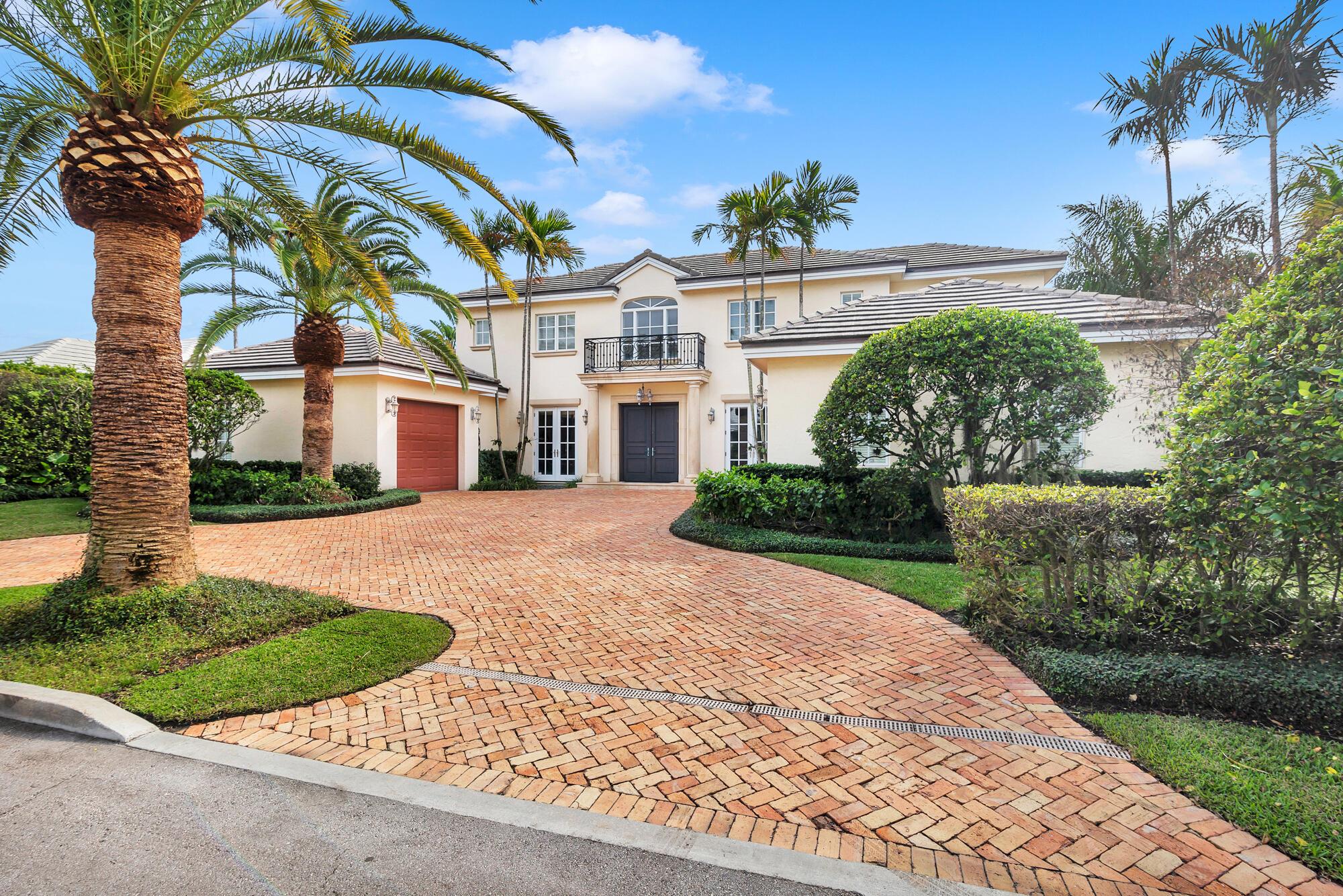 Perfectly located north end residence, with shared ocean beach access. Enjoy this 4 bedroom and 4.2 bath, 5,000 sq.ft. residence now or re-imagine it with your own touches. The backyard has a tropical vibe with mature plantings, colorful bougainvillea, and a heated pool and spa. Inside features include a main level primary suite with adjacent office, custom kitchen with granite counters, butler's pantry & morning bar, wine closet, mahogany wood floors, and impact windows throughout. Upstairs is a spacious covered balcony and 3 additional en-suite bedrooms. This residence is completed by 2 separate attached garages. This north end Palm Beach residence is a lovely place to start living your Palm Beach lifestyle.