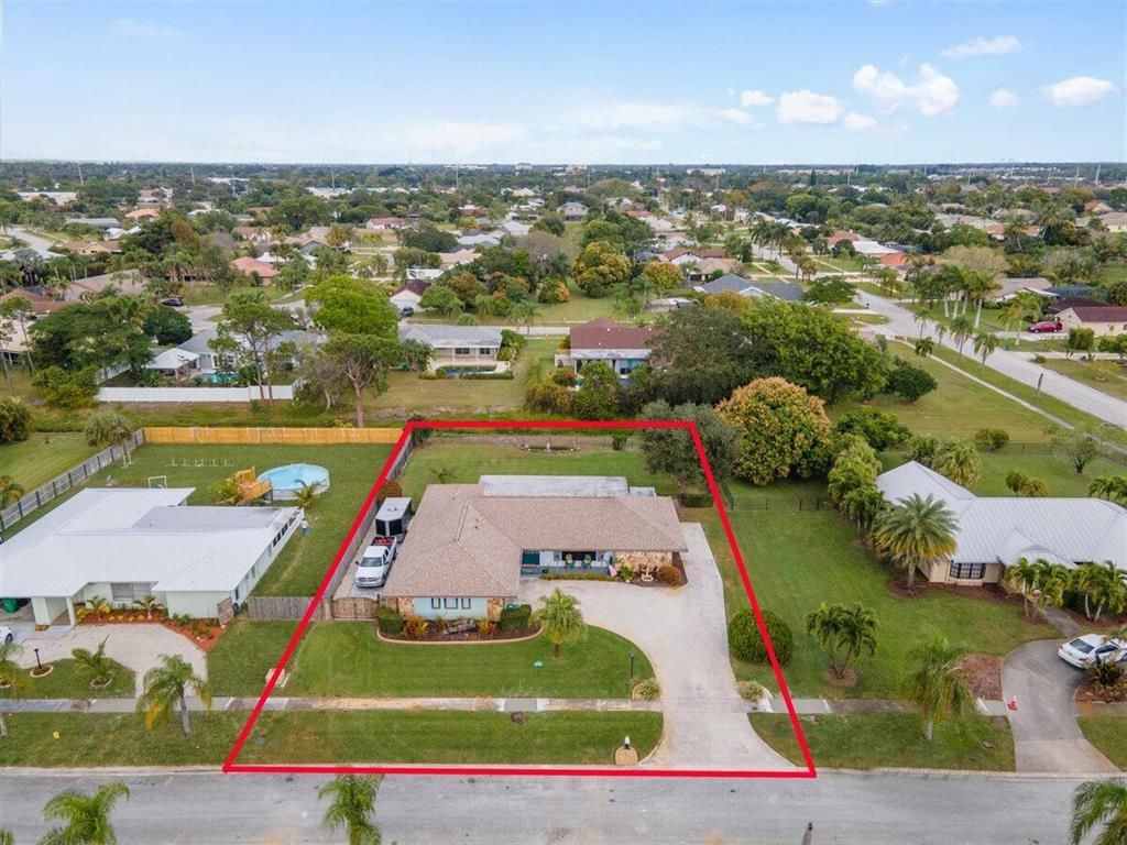 Photo of 1881 SE Boma Avenue, Port Saint Lucie, FL 34952 (MLS # R10771706)