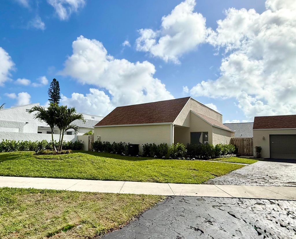 Photo of 875 NW 22nd Avenue, Delray Beach, FL 33445 (MLS # B26012783)
