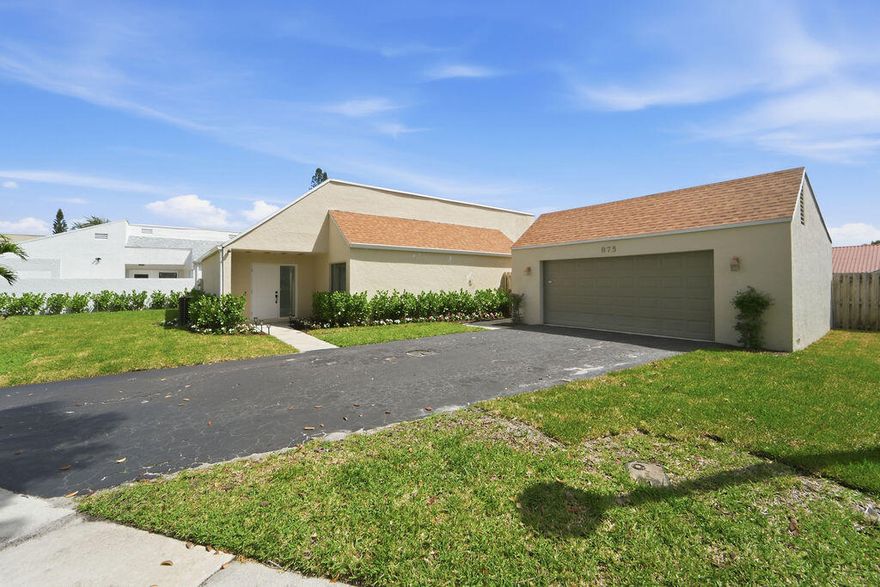 Beautifully renovated 3-bedroom, 2-bath home w/ 2 car garage featuring an open and airy floor plan with abundant natural light. Enjoy a bright new kitchen with white shaker cabinets, quartz countertops, and stainless steel appliances. Large format porcelain tile flooring flows throughout, and both bathrooms feature new vanities, tile, and fixtures. Additional highlights include a Brand new A/C and water heater, 2021 roof and a spacious 2-car garage and fenced back yard and new landscaping. Move - In Ready! Rainberry Lake amenities include two community pools, both located on the lake, tennis courts, pickleball courts, and a basketball court. Rainberry Lake is centrally located in Delray Beach, with direct boat access to Lake Ida and Lake Eden—all just minutes from vibrant Atlantic Avenue,  shops, dining and Delray's stunning beaches.  Move-in ready, pet-friendly, and set in one of Delray's most sought-after gated neighborhoods—this home is the perfect blend of convenience and coastal charm. Check out all Rainberry Lake has to offer.