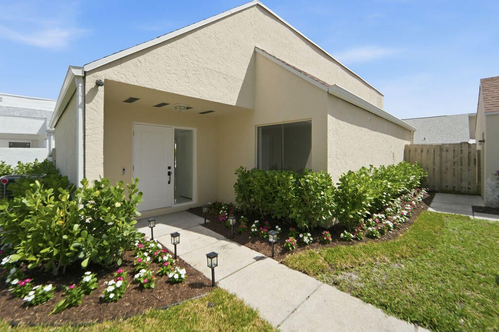 Photo of 875 NW 22nd Avenue, Delray Beach, FL 33445 (MLS # B26012783)