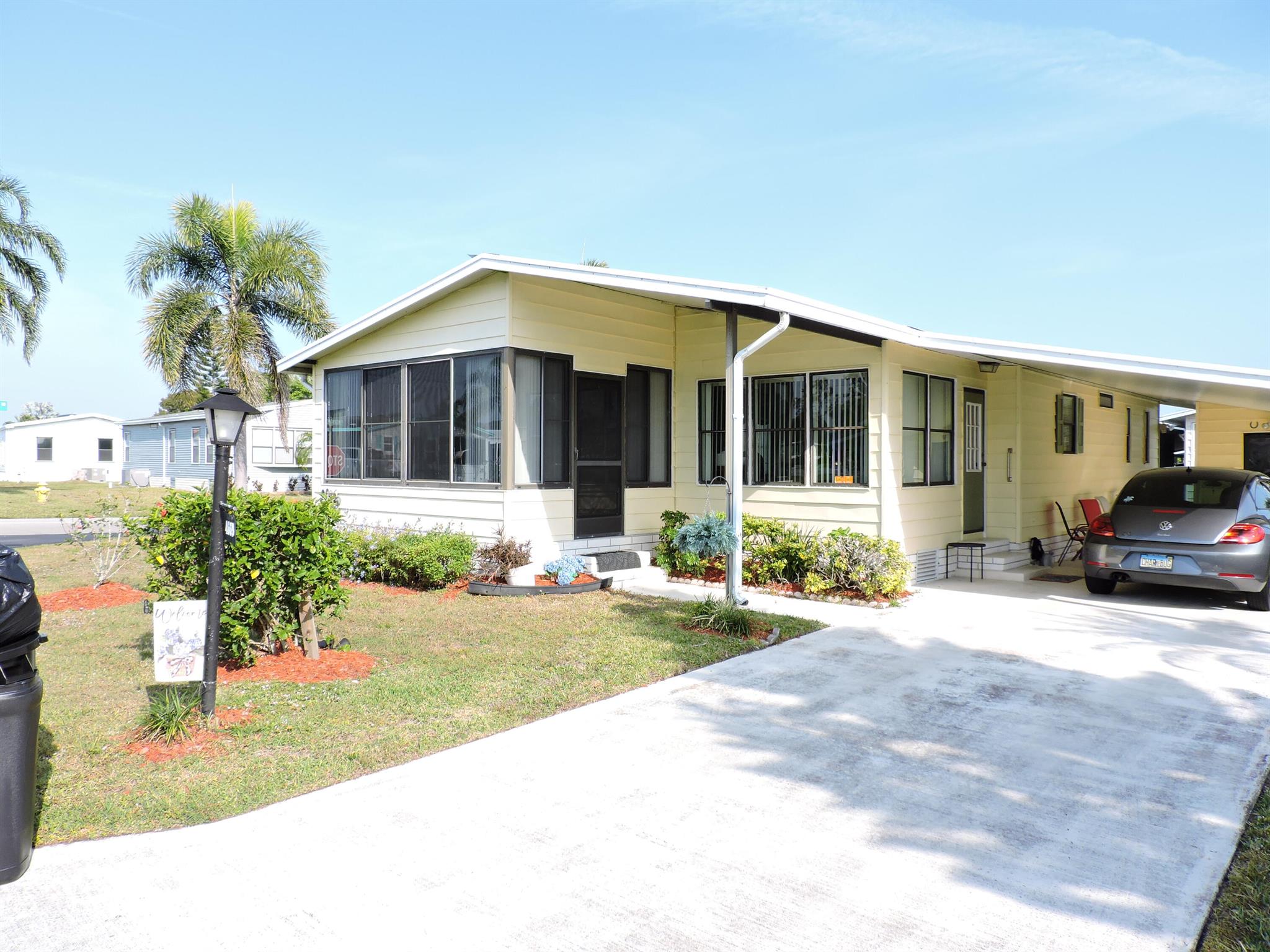 What a great neighborhood in the Pinelake Gardens section for this manufactured home that has a 2 bedroom, 2 bath, carport. Corner lot, nice and bright in this friendly quiet neighborhood. Stainless steel appliances, off white kitchen cabinets, wood laminate floors in bedrooms and ceramic tile in kitchen, dining and living room. Plenty of storage in shed off of carport which is attached and has a full washer and dryer. 55 and over neighborhood which has 2 clubhouses, 2 community pools, plenty of shuffleboard courts, community meeting or event rooms for all your big party events. Conveniently located in quiet location but minutes away to all of your shopping needs which includes Walmart, grocery, restaurants, banks, Lowes home improvement store. Tenant occupied till end of April.