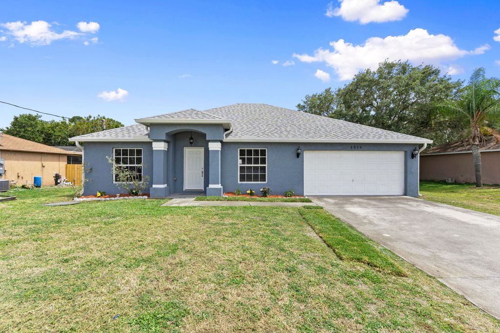 Photo of 1024 SW Estaugh Avenue, Port Saint Lucie, FL 34953 (MLS # B26025421)