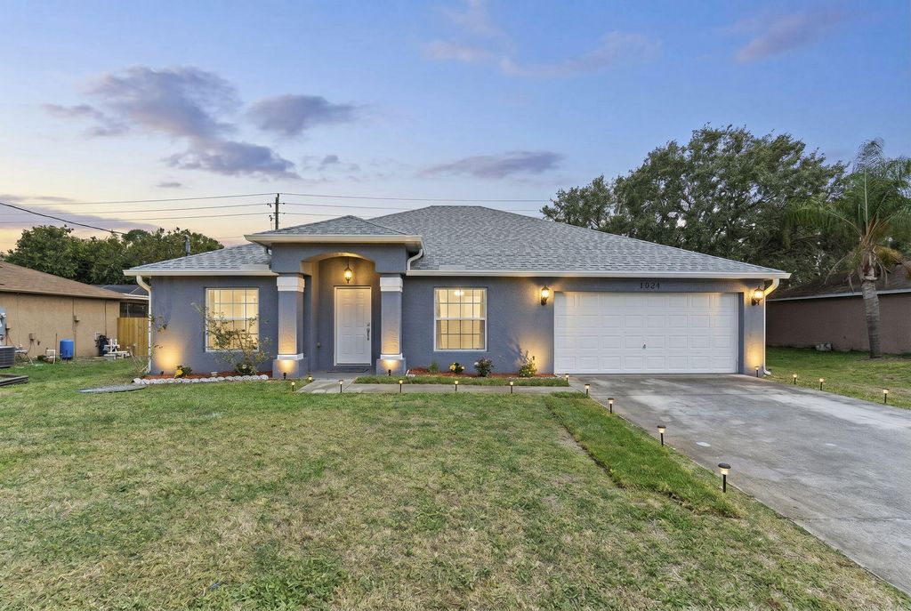 Photo of 1024 SW Estaugh Avenue, Port Saint Lucie, FL 34953 (MLS # B26025421)