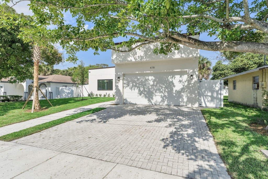 Photo of 478 NW 1st Avenue, Deerfield Beach, FL 33441 (MLS # B26031401)