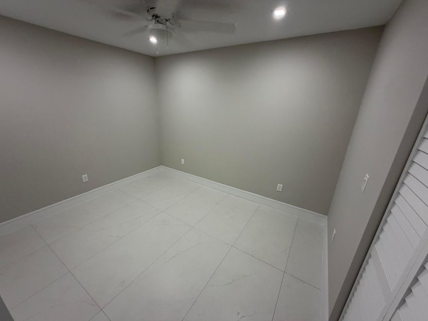 Completely rebuilt from the ground up, this stunning home offers the feel of new construction in the heart of Pompano Beach. Designed with modern style and high-end finishes, it features porcelain tile flooring throughout and a brand-new kitchen with sleek cabinetry and new appliances. Major upgrades include a new roof, new A/C, and impact windows, providing comfort and efficiency. Enjoy a screened porch perfect for relaxing or entertaining, plus a fully bricked and fenced backyard offering privacy and low maintenance. A rare opportunity to own a completely rebuilt, move-in-ready home in a well-established neighborhood.