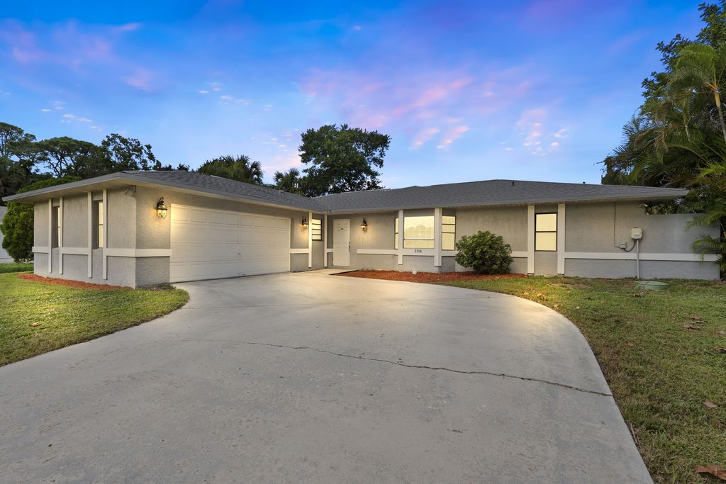 Photo of 2316 SW Lejune Street, Port Saint Lucie, FL 34953 (MLS # R11141878)