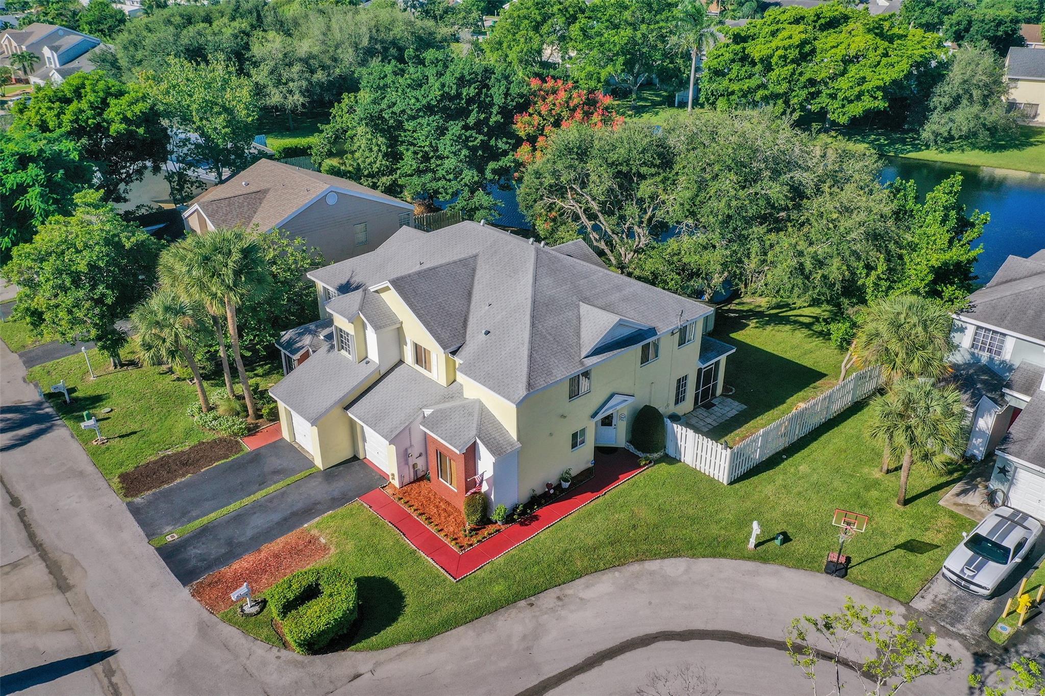 Beautiful 4BR/2.5BA home with 1-car garage in the highly desirable Scarborough community! Primary suite offers dual large walk-in closets & extra windows for added natural light. Laundry upstairs near bedrooms. Features partial impact windows/doors, screened tile patio, oversized backyard & serene lake views. Roof, A/C & water heater replaced in 2016. One of the largest townhome lots in the community at 6,605 sq ft! Provides the comfort of a single-family home feel with the convenience of townhome ownership. Enjoy the convenience of an added parking space by the driveway. Low HOA includes lawn care & exterior painting (scheduled for early 2026). Community amenities: pool, clubhouse, playground, basketball & tennis courts. Home can be rented with no waiting period after purchasing.