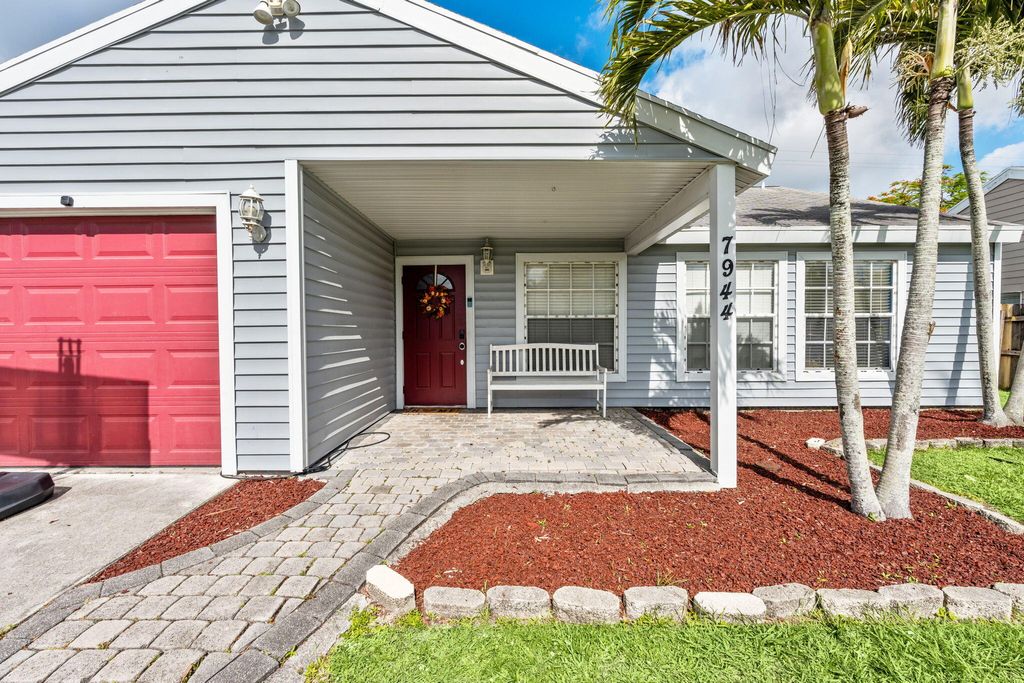 Photo of 7944 Ridgewood Drive, Greenacres, FL 33467 (MLS # B26031848)