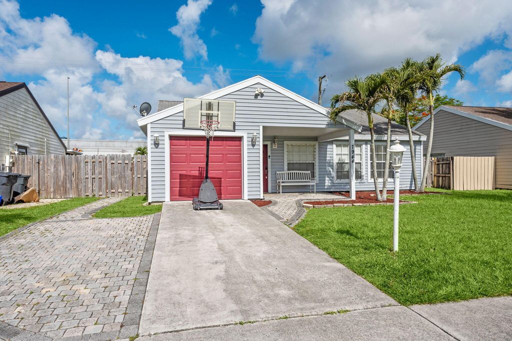 Photo of 7944 Ridgewood Drive, Greenacres, FL 33467 (MLS # B26031848)