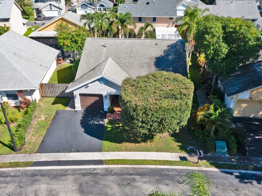 This stunning 3-bedroom, 2-bath home in Sawgrass Estates offers high ceilings, abundant natural light, and an excellent layout with many upgrades throughout, including a semi-remodeled kitchen with granite countertops, stainless steel appliances, and a remodeled guest bath. The property features laminate and tile flooring, full smart-home automation, and a beautifully landscaped backyard with a large paved patio, gazebo/tiki bar, and double gate with space. Perfect for entertaining or relaxing, this home combines comfort and style while being ideally located just minutes from Sawgrass Mills Mall and close to all major highways.