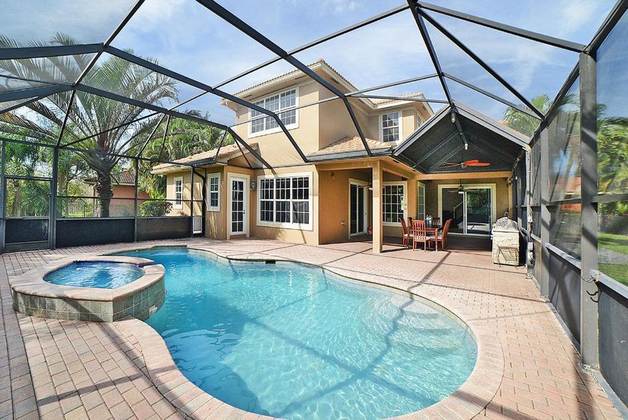 COME SEE THIS HOME ON SUNDAY3/26 1pm-3pm
Located on the largest lot in Paseo, this Mariposa model 2 story home features 4 bedrooms, 4 full baths, covered patio with gourmet summer kitchen and pool overlooking the preserve with a convenient cabana bath. This highly customized and upgraded home is protected by a whole-house generator, impact windows, private fenced yards on either side of the screened pool. Upon arriving your guests will have plenty of parking on the paver driveway. Owners will enjoy the outdoor dining area at the front of the house as well as a large covered porch surrounded by tropical landscaping. The grand entry foyer with custom tile inlay opens to the formal living room, dining room, open kitchen with stainless appliances, large pantry, double oven and built-in custom bench seating with added storage. You will be mesmerized by the large great room featuring one of a kind dual salt water fish tanks with room remaining for a new large TV. The 4th bedroom is located on the first floor with a full bathroom. Upstairs finds the master suite featuring a tray ceiling detail, custom built office space for 2, custom built closets, private master bath with dual vanities, soaking tub, dual shower heads with jets in the shower, chandelier and private water closet. The laundry room with ample storage and sink is located on the 2nd floor as well as 2 more bedrooms in a split floor plan. All bedrooms have updated and upgraded plush carpeting while the remainder of the home has tile flooring and wood laminate on the wrought iron decorated staircase with volume ceilings.