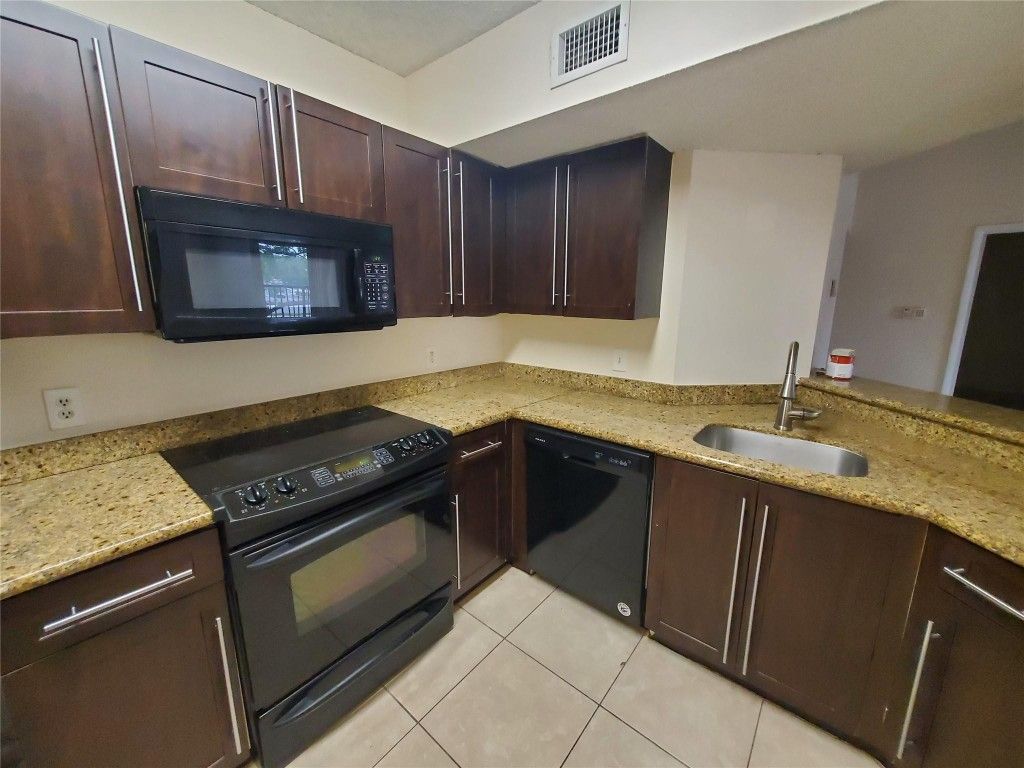 Photo of 8977 Wiles Road #305, Coral Springs, FL 33067 (MLS # F10459849)