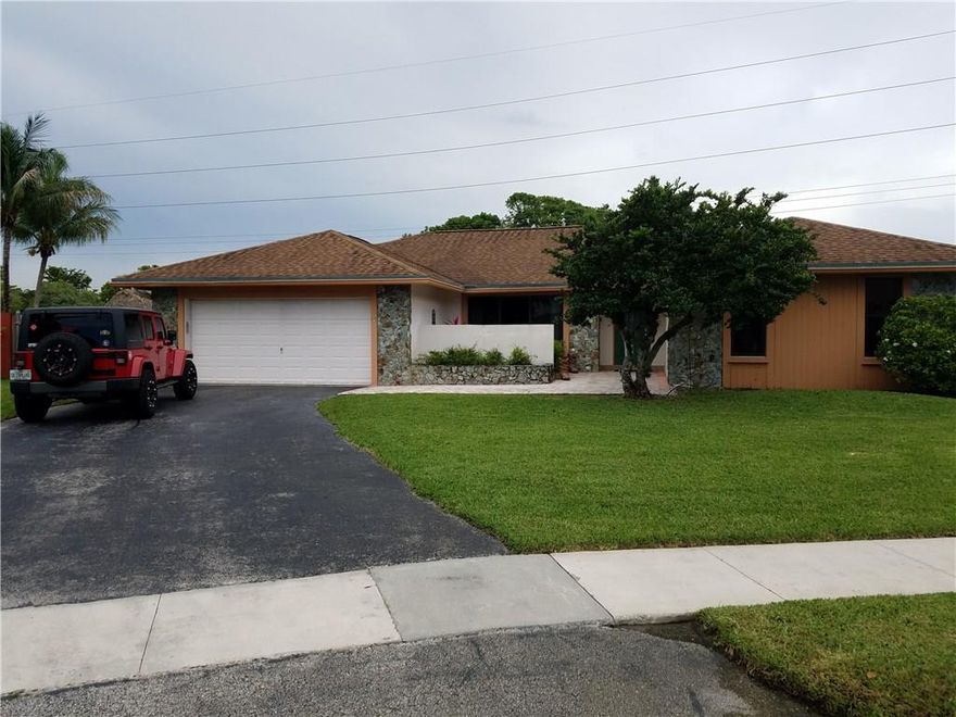 GREAT NEW LISTING IN MARCANO ESTATES.   THIS  FOUR BEDROOM TWO BATH HAS A VERY OPEN FLOOR PLAN. THIS  HOUSE HAS ALL THE UPDATES. VOLUME CEILINGS IN THE FAMILY AREA.  FIREPLCE    NEW IMPACT WINDOWS AND FRENCH DOORS.  THE RESORT STYLE  POOL HERE WILL KNOCK YOUR SOCKS OFF.  BEYOND INCREDIBLE.   LARGE OPEN FAMILY AREA. NEWER KITCHEN.   FORMAL DINNING ROOM.   ALL BEDROOMS ARE SPACIOUS.  UPGRADED LIGHTING WITH HIGH HATS IN BEDROOMS.   EXTRA LARGE WATER FRONT LOT. STORAGE SHED OUT BACK.  TIKI HUT.  A MUST SEE!