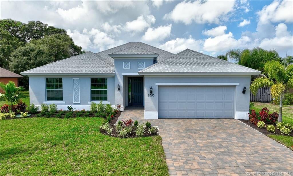 Photo of 2050 SE Parrot Street, Port Saint Lucie, FL 34952 (MLS # R10884932)
