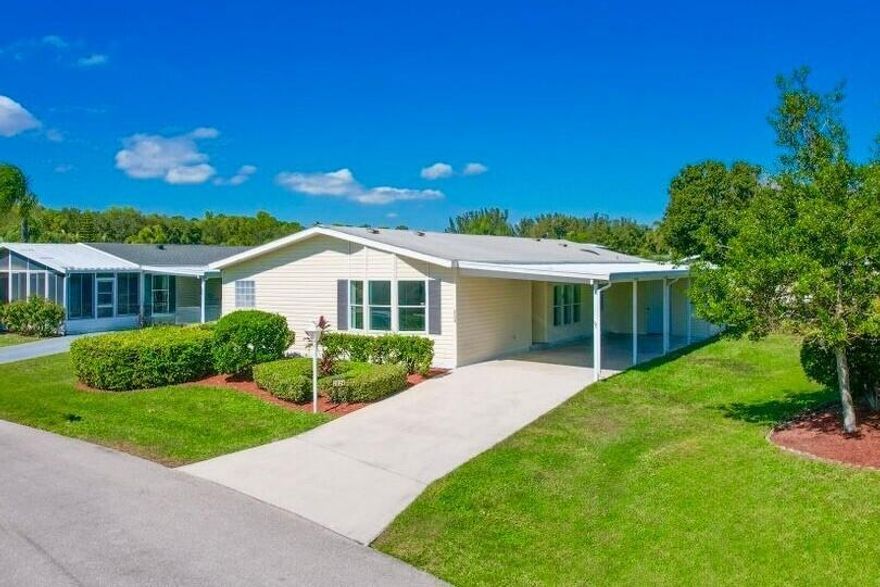 Welcome to this spacious 3-bed, 2-bath modular home nestled on a quiet cul-de-sac in the sought-after 55+ Savanna Club community. This open-concept layout features two separate living areas and wood-look tile flooring throughout the main living spaces. Recent upgrades include new A/C unit, water heater, and a reverse-osmosis system offering peace of mind and year-round comfort. The home also includes a long carport, a large attached storage room, a covered screened patio, and an additional cement slab that's perfect for outdoor entertaining.Savanna Club offers a true resort-style lifestyle with access to an 18-hole golf course, a 10,000 sq. ft. performing arts center, four fully staffed clubhouses, a tennis and fitness center, and a full calendar of social events and activities.