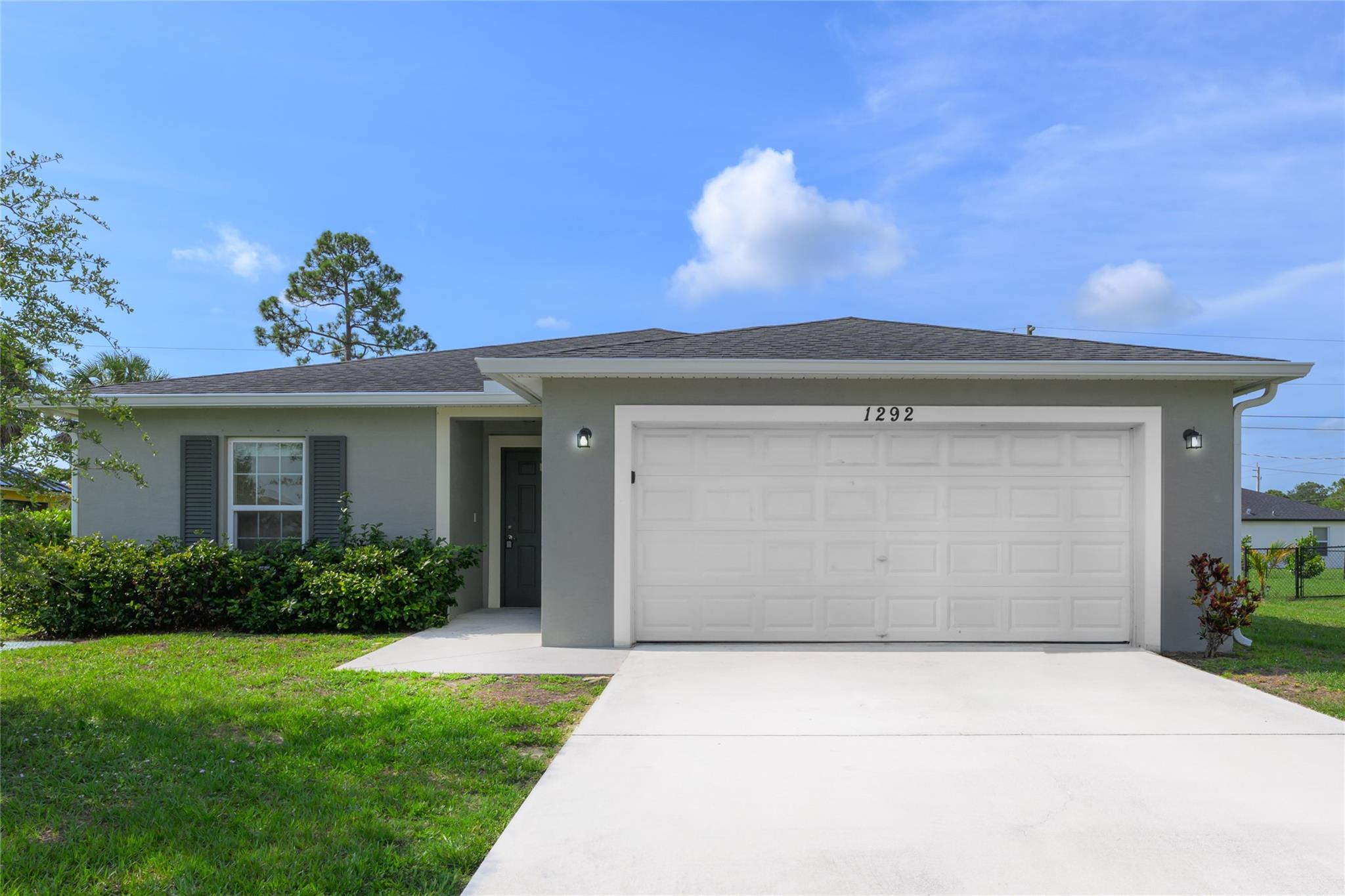 Spectacular 2020-built Hudson 4 Model home featuring 4 bedrooms, 2 bathrooms, a 2-car garage, and approximately 1,833 sq. ft. under air with a total of around 2,350 sq. ft. including the covered patio. This open-concept home offers spacious living areas, generously sized bedrooms, and spa-like bathrooms. Numerous upgrades include stainless steel appliances, washer and dryer, ceiling fans, window blinds, and solid surface countertops. Located just minutes from schools, the Gatlin shopping area, and I-95, this home is a perfect blend of comfort, style, and convenience—move-in ready and waiting for you!