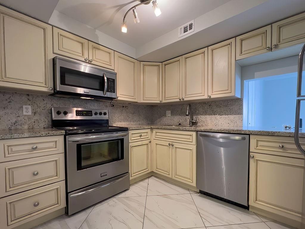 TAKE A DEEP BREATH IN AND SMELL THE OCEAN DIRECTLY ACROSS THE STREET. NOW IMAGINE STROLLING A FEW BLOCKS TO WORLD FAMOUS LAUDERDALE BY THE SEA TO HAVE A BITE TO EAT, THEN SHOP WHILE LIVE ENTERTAINMENT PLAYS IN THE PROMENADE. ALL THIS CAN BE YOURS AT GOURGEOUS END UNIT FEATURING AN ALL UPDATED INTERIOR INCLUDING CUSTOM CABINETS, GRANITE COUNTERS AND STAINLESS APPLIANCES. THE ENTIRE UNIT HAVE LARGE TILED FLOORS THAT COMPLEMENT THE WALLS COLOR HUE. THERES MORE! THIS UNIT COMES WITH A WASHER/DRYER AND A POWDER ROOM, AS WELL HAS UNDERGROUND PARKING AND AN ELEVATOR WHICH TAKES YOU TO YOUR FLOOR. AND IF YOU DONT WANT TO BASK BY THE OCEAN, SIMPLY TAKE A DIP IN THE ONSITE POOL. SOUTH FLORIDA IS AWAITING YOUR ARRIVAL!