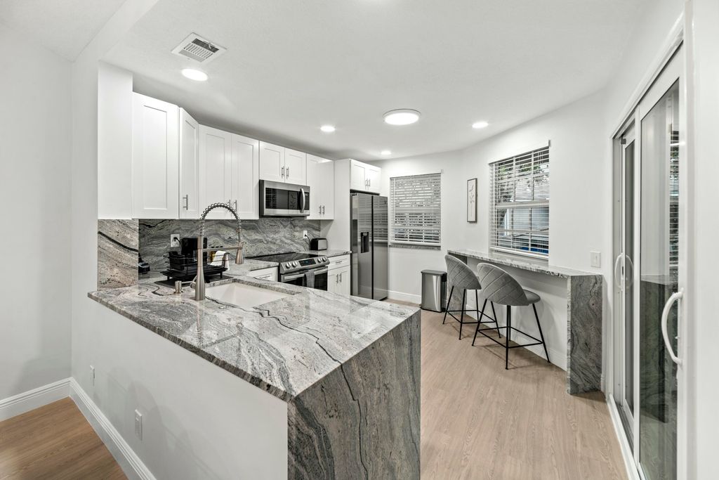 Photo of 6553 Via Regina, Boca Raton, FL 33433 (MLS # B26014898)