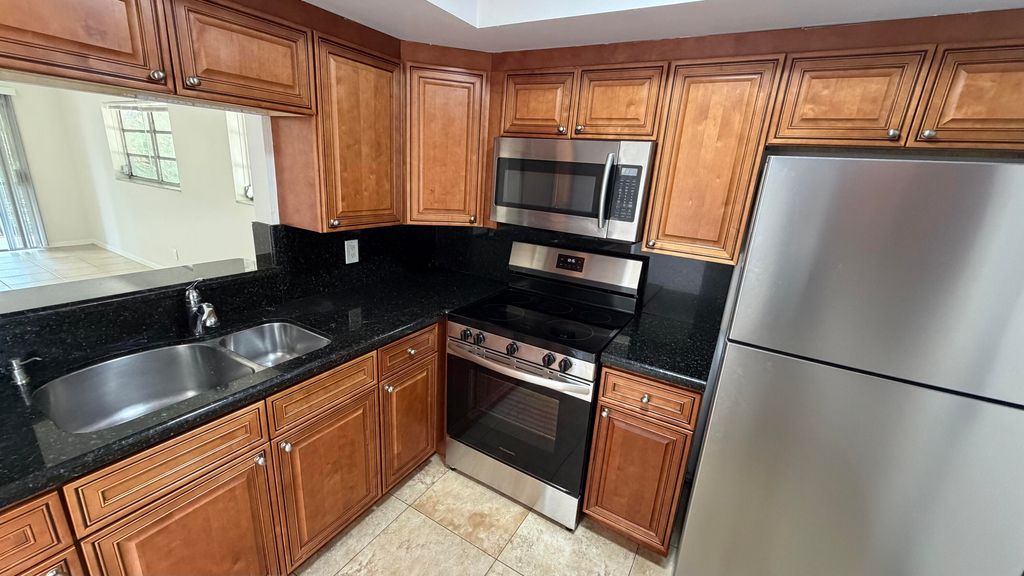 Photo of 4061 NW 9th Avenue #206, Deerfield Beach, FL 33064 (MLS # B26024818)