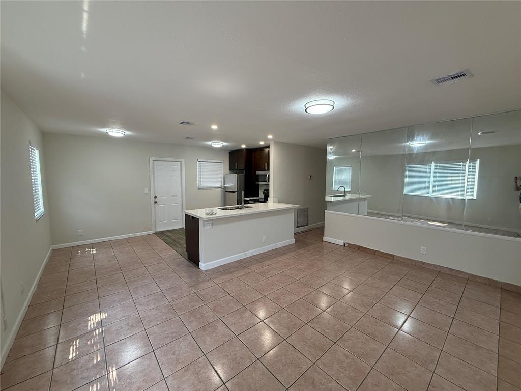 FAST APPROVAL .FIRST AND SECURITY DEPOSIT .This freshly painted 3-bedroom, 1-bathroom home is move-in ready and located on a quiet street. It features a spacious layout with central AC, quartz countertops, stainless steel appliances, and a dedicated laundry room. Outside, you'll find a fenced-in backyard with fruit trees, a covered patio, a covered carport, and a nicely sized driveway. The home offers both comfort and functionality with rapid approval available. Just bring first, last, and security—and the house is yours. Available now, so call today to schedule a showing!