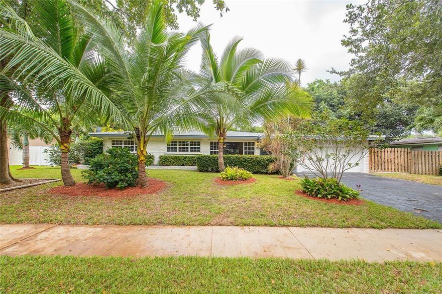 This spacious 3/2 home is situated on an oversized lot in the heart of Plantation, featuring a bright open living/dining/Florida room with large kitchen.  Granite countertops, tile floors throughout, brand new roof, hurricane shutters, big fenced yard, with room for a pool. Huge covered wood deck, great for outdoor entertaining. 2 car garage with storage area. Large laundry/storage room with new washer/dryer. Additional RV/Boat parking on the side. Great location close to parks and shopping.