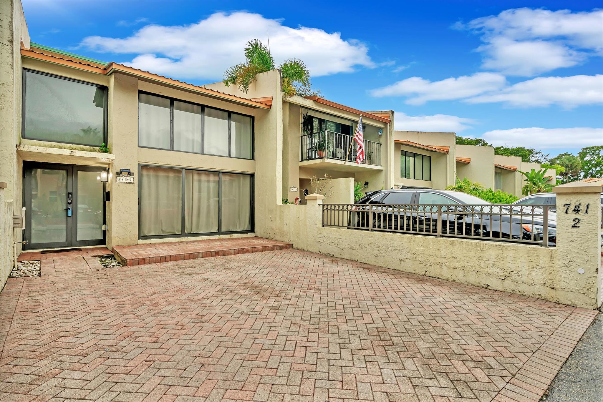 Welcome to this beautifully updated townhouse-style condo located in the heart of Plantation at 714 E Coco Plum Circle #2. This spacious and residence offers 3 bedrooms and 2.5 bathrooms with a bright, open floor plan designed for comfortable living and entertaining. The home features a modern kitchen with updated cabinetry, stainless steel appliances, and ample counter space, along with light-filled living and dining areas. Upstairs, the generously sized bedrooms share a jack and jill bathroom offering convenience and privacy. Additional highlights include in-unit laundry, a half bath on the main floor, and a private patio ideal for relaxing or dining al fresco. This residence is part of the highly sought-after community of Majestic View, known for its lush landscaping an