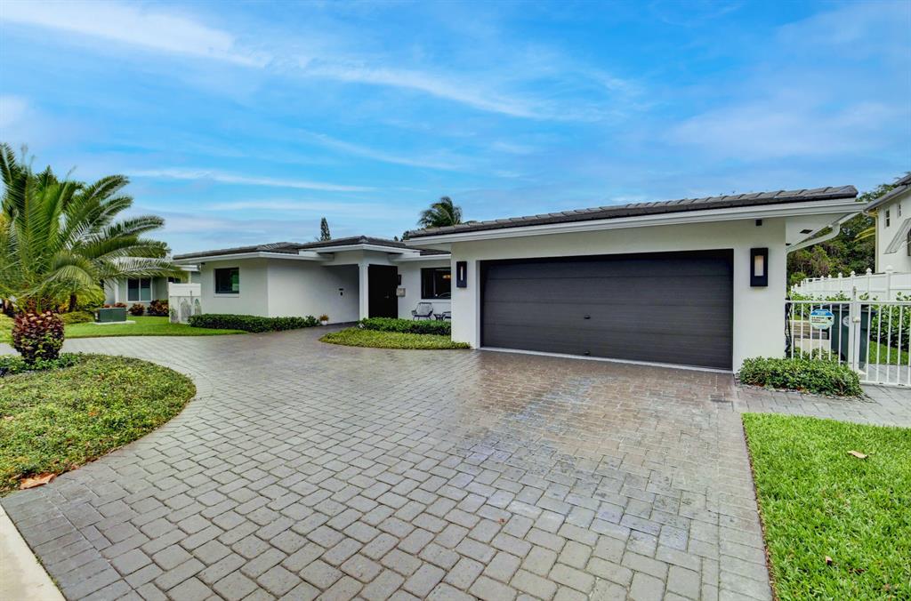 Completely customized and rebuilt in 2019, you will fall in love from the moment you walk into this open, light, bright, modern home. This 4/3.5 plus den pool home overlooks the El Rio waterway that leads to ocean access. The new approximate 40 foot composite dock with a raised, reinforced retaining wall is perfect for any boater. The nature preserve across the waterway provides privacy, as well as, attracts lots of birds and wildlife to enjoy watching from your backyard or large covered patio. The island kitchen offers European white cabinetry to the ceiling with soft close and glass doors, quartz countertops with a marble backsplash. The floor plan is a 3-way split with the master bedroom on the back of the house overlooking the waterway.