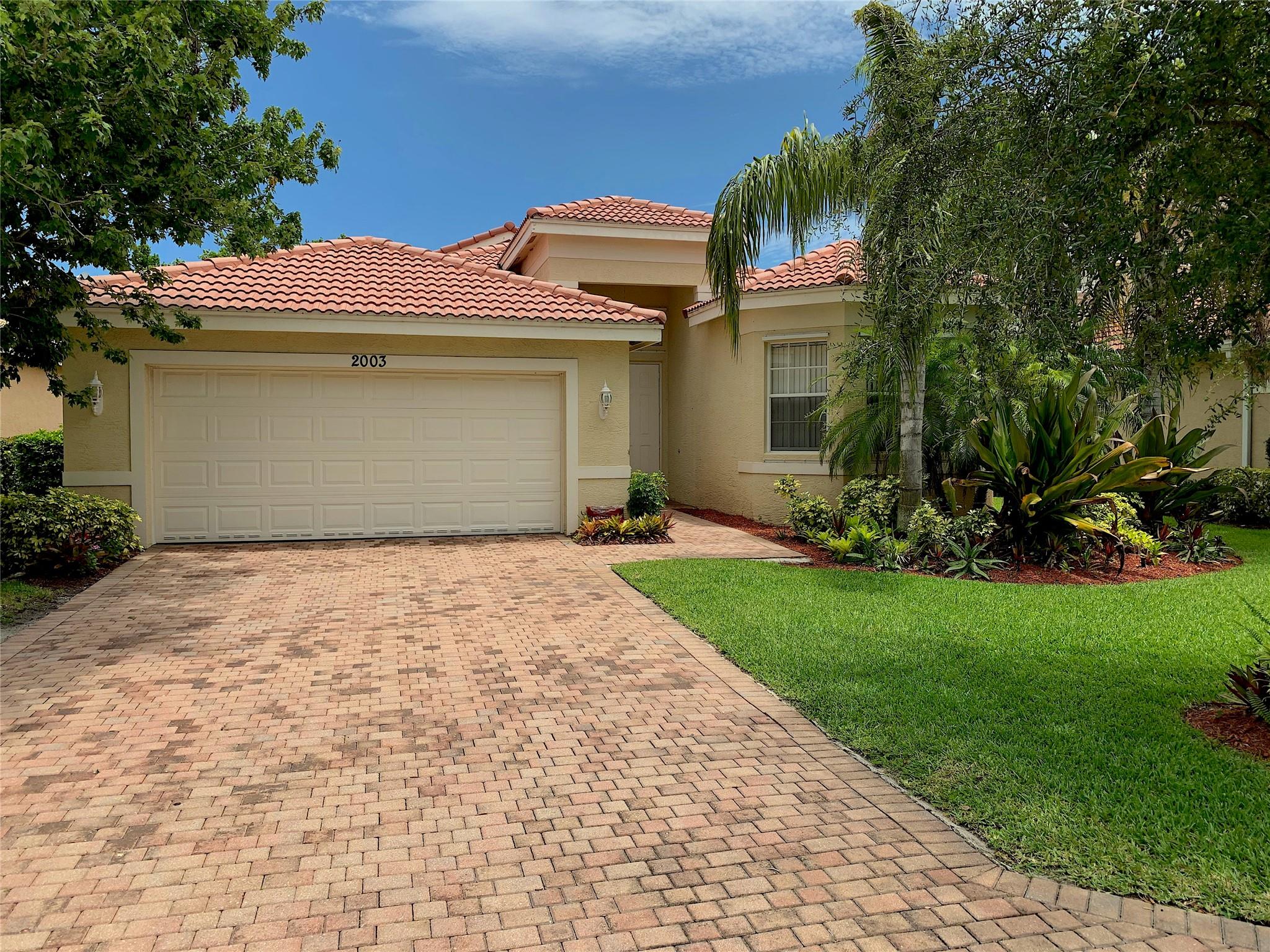 Gated community in Vero Beach : Falcon Trace. Home offers easy living with living/dining room, separate family room off the kitchen. Breakfast area. White cabinets, SS appliances. No carpeting! 3 way split plan. Master suite has beautiful tray ceiling, elegant wood-like flooring. Separate tub and shower. Laundry room with full size washer/dryer and utility sink. Clubhouse, pool, kiddie pool, tot-lot, basket/tennis/pickle ball/volleyball courts. Fitness & social rooms. Rent includes lawn service