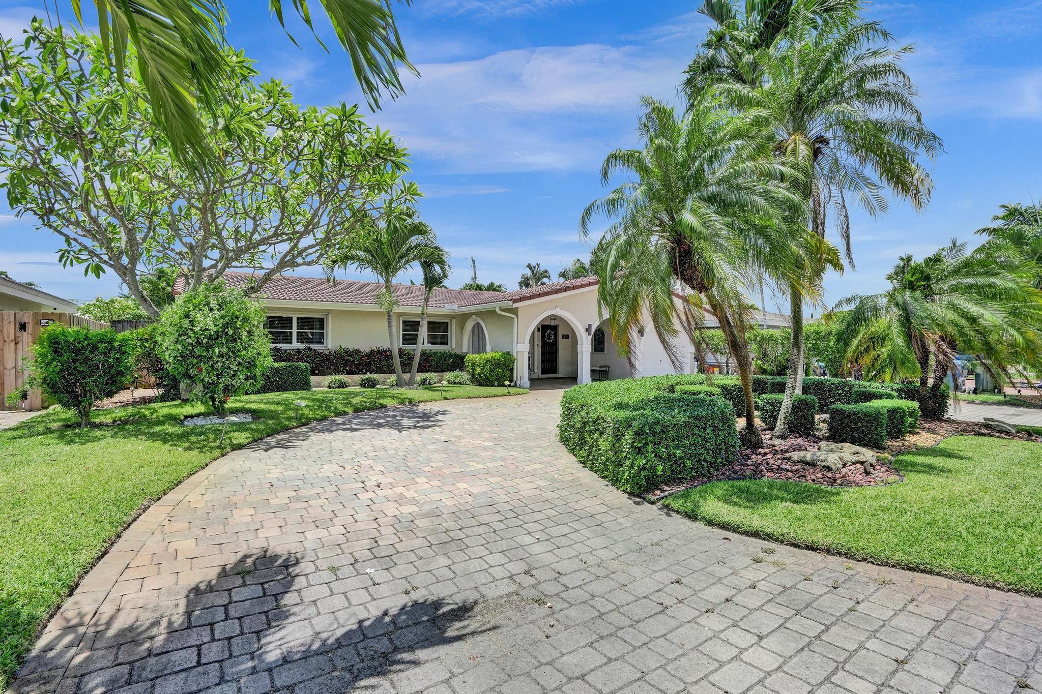 Effortless South Florida living with this beautifully maintained 3-bedroom, 2-bath home in desirable east Oakland Park. This home places you minutes from sandy beaches, Wilton Drive, local parks, vibrant dining spots, and boutique shopping. Designed for comfort and casual elegance, this home boasts a large kitchen ideal for entertaining, a bright Florida room perfect for morning coffee, and a layout that flows seamlessly to the backyard oasis. Enjoy sunny days in the heated swimming pool, dine al fresco on the large patio, or relax under the shade of the poolside lanai. With an attached garage, whole home generator, and a welcoming front porch framed by vibrant landscaping, this home blends convenience, charm, and lifestyle with ease. All in a neighborhood with a friendly, relaxed vibe.