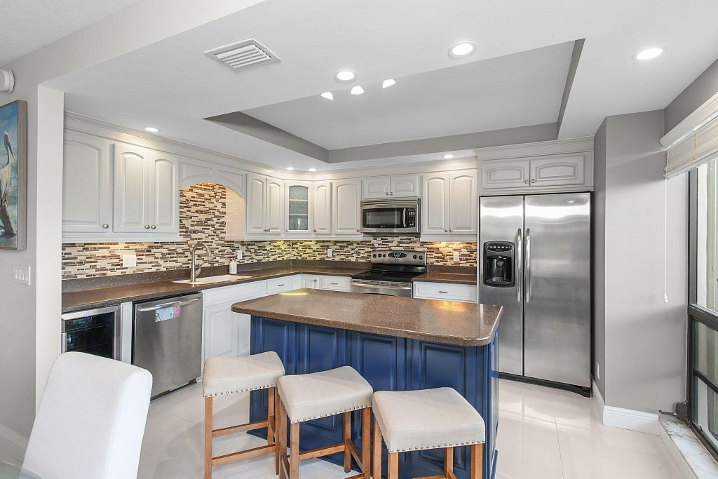 Photo of 460 Brackenwood Lane S, Palm Beach Gardens, FL 33418 (MLS # R11033092)