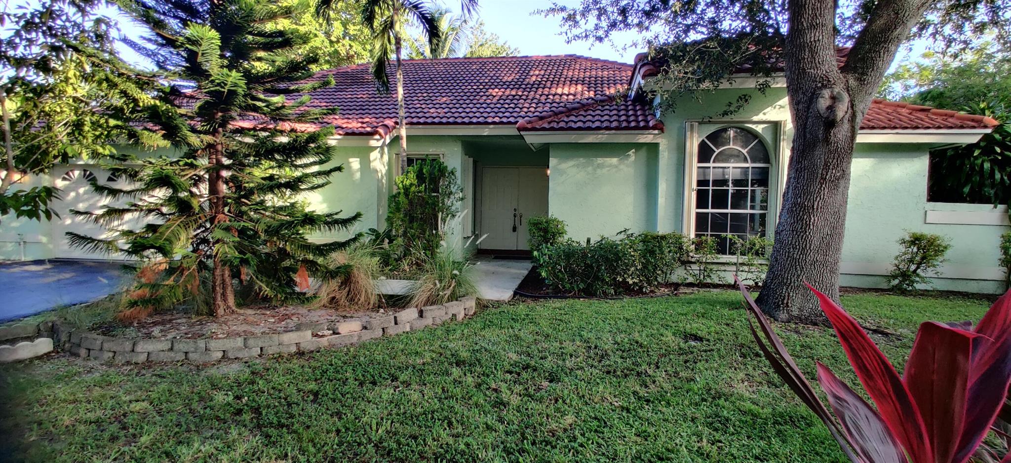 The house is located the heart of Coconut Creek community of Winston Park. Nestled on cul-de-sac on a quarter acre, with lot with mature fruit trees and a fenced in yard.A 500sft sunroom leads out to the backyard paver patio. You will find an open floor plan tiled great for entertainment. The kitchen has stainless steel appliances and granite counter tops. The house comes with accordion shutters, 2 car garage.Easy access to the Sawgrass and Turnpike close to Coconut Creek downtown promenade.Move in ready a great place to call your home. No HOA process so fast move in. Lawn Care is included by Landlord.