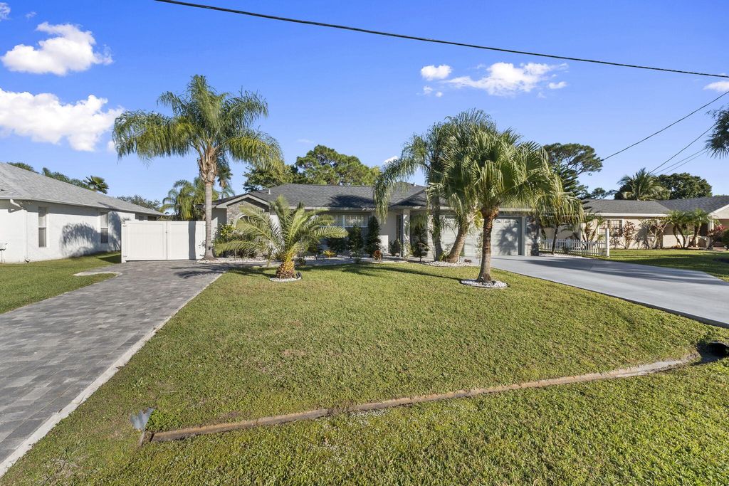 Photo of 2471 SE Leithgow Street, Port Saint Lucie, FL 34952 (MLS # R11144093)