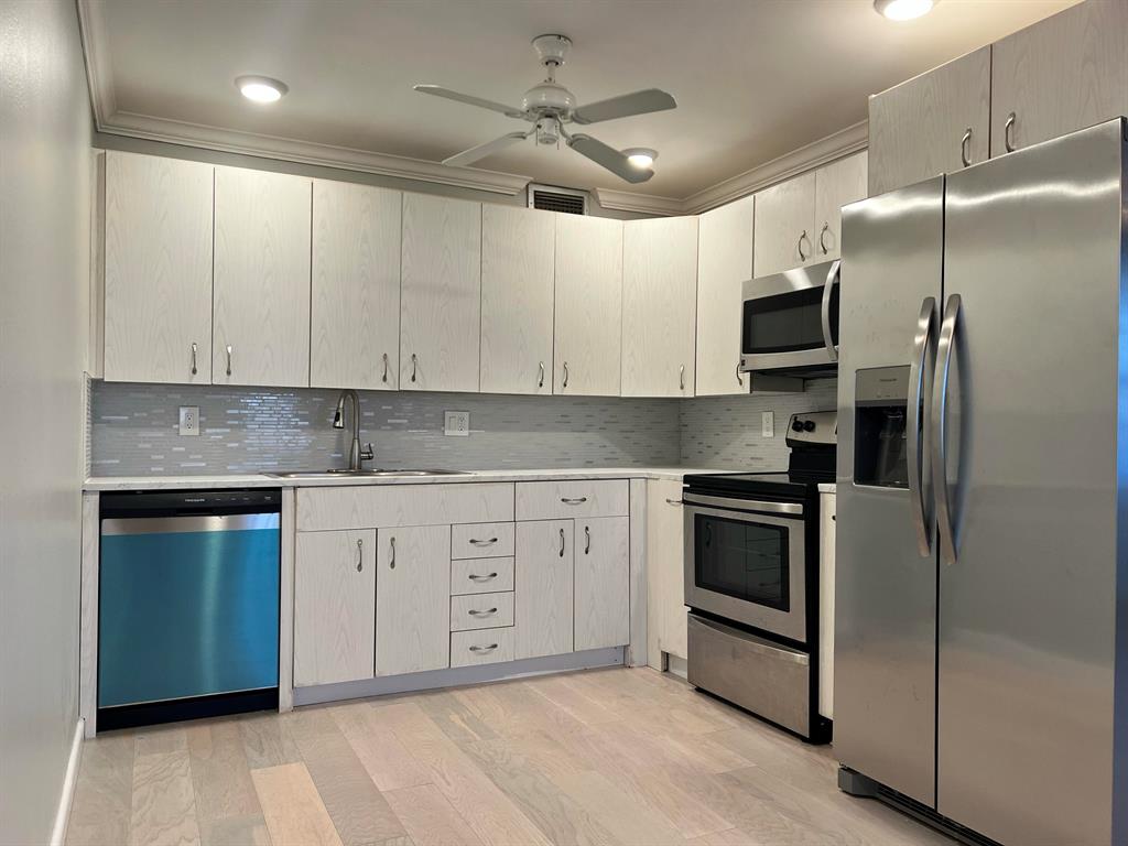 Highly desirable 2 bedroom, 2 bath condo on third floor with spectacular lake views from screened in balcony. Freshly painted, brand new flooring, new kitchen counter, new appliances, updated bathrooms. Internet & Cable included. Common Laundry Facility, Bldg Elevator. One assigned parking, plus guest Amenities include: indoor an outdoor pools, fitness center, courtesy bus service, gated 24/7...55+ Adult Community.