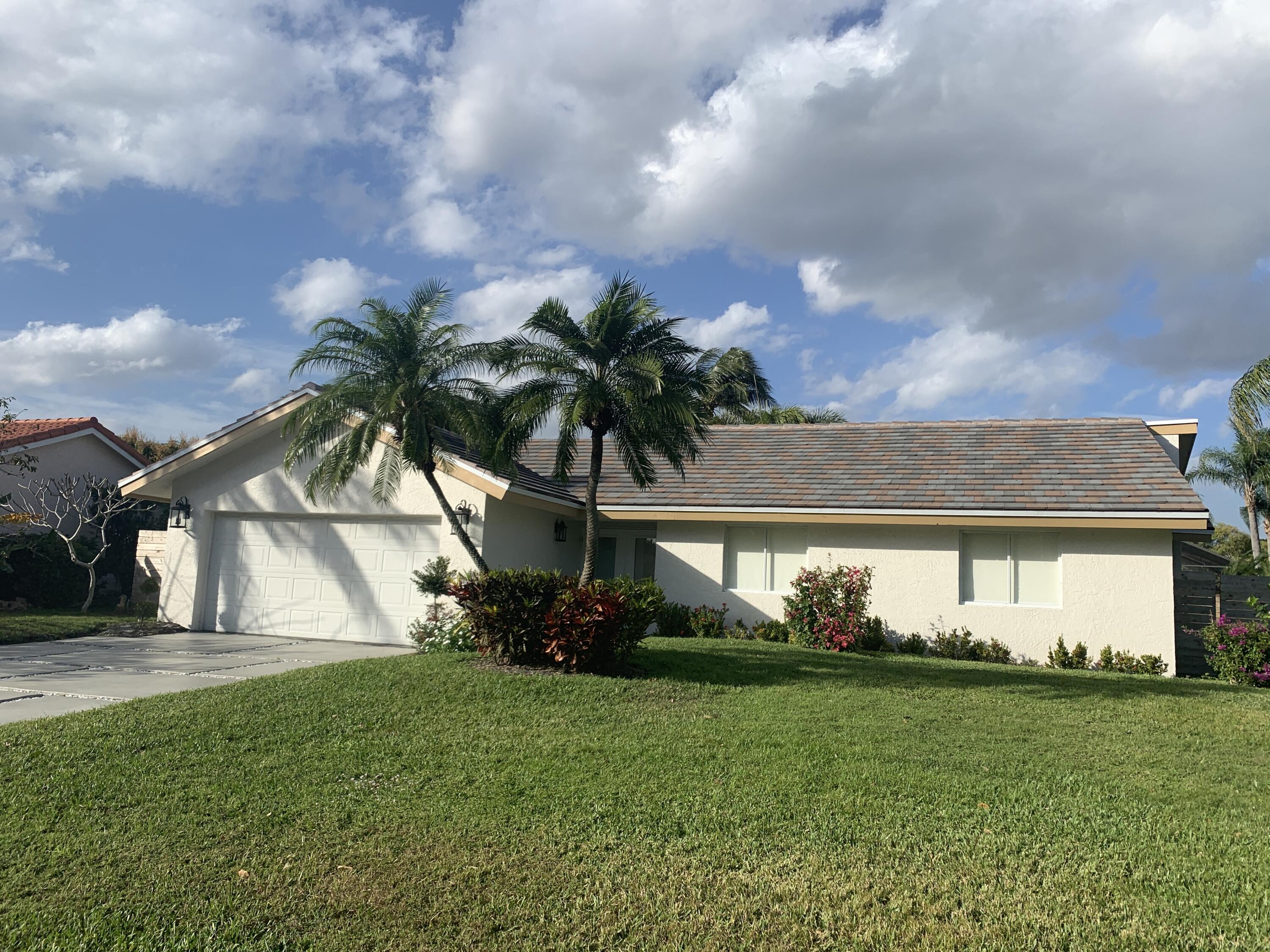 This gem of a home provides the perfect retreat in the perfect location. Ideally nestled in the picturesque neighborhood of Timbercreek in Boca Raton is this 3 BR / 2 BTH, completely remodeled home. This residence offers everything luxury: brand new kitchen w/ wood cabinetry that soft closes, new appliances, & quartz countertops, new ceramic ''wood'' flooring throughout, completely remodeled bathrooms w/ designer features, new front elevation w/ improved landscaping, & a 2 car garage. The open floor plan and sliding glass (impact glass) doors that canvas the entire great room & the master bedroom make this home the ultimate place for both entertaining and relaxing. Located near parks, beaches, private & top rated public schools, entertainment & major roadways... Welcome home!